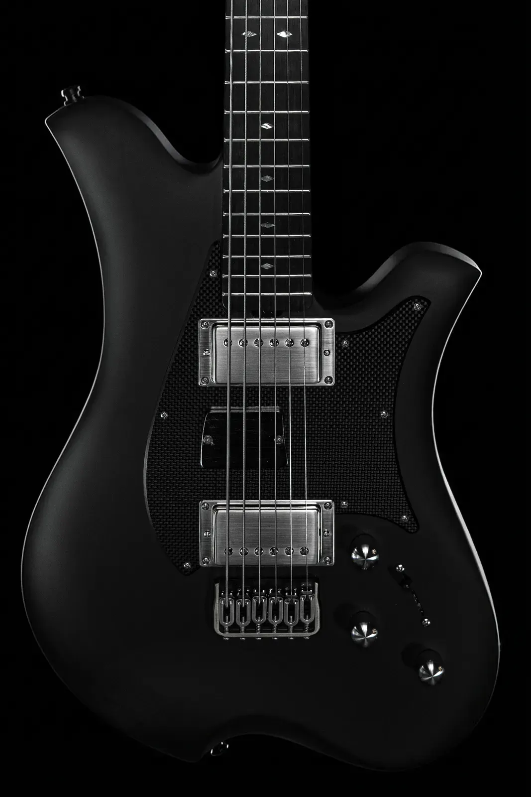 Munky of Korn's black Carbon Fiber Leonardo Officina Baritone, dual-output baritone by Bacci Guitars